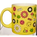 Flower Smiley Face Icon Coffee Mug - 20 oz. at Spencer's