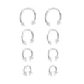 Multi-Pack Silvertone Glitter Horseshoe Rings 4 Pair - 16 Gauge at Spencer's