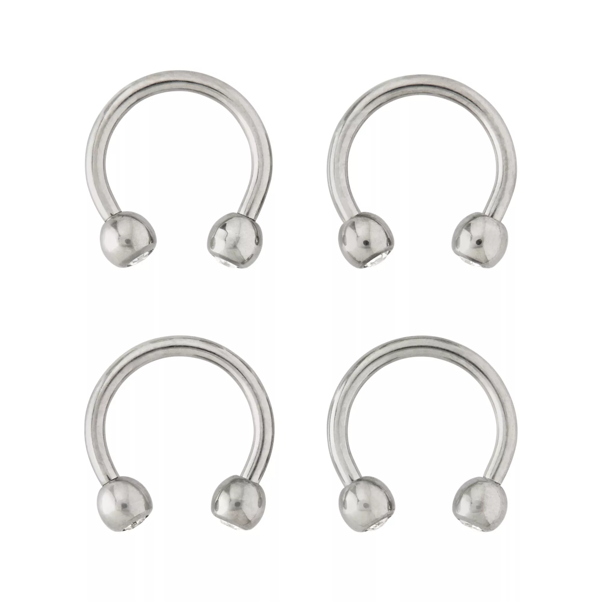 Multi-Pack CZ Silvertone Titanium Horseshoe Rings 4 Pack - 16 Gauge at Spencer's