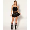 Black Playboy Pleated Mini Skirt at Spencer's