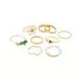 Multi-Pack Goldtone Flower Green Gem Band Rings - 9 Pack at Spencer's