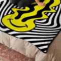Trippin' Smileys Double-Sided Fleece Blanket at Spencer's