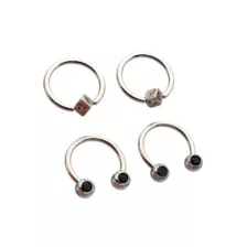 Multi-Pack Black CZ Dice Titanium Horseshoe Rings and Captive Rings 2 Pair - 16 Gauge at Spencer's