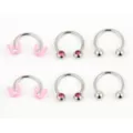 Multi-Pack Pink Butterfly and Pronged Horseshoe Rings - 6 Pack at Spencer's