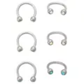 Multi-Pack Blue CZ Aurora Borealis-Effect Titanium Horseshoe Rings 3 Pair - 16 Gauge at Spencer's